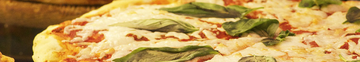 Eating Pizza at Revere House of Pizza restaurant in Revere, MA.